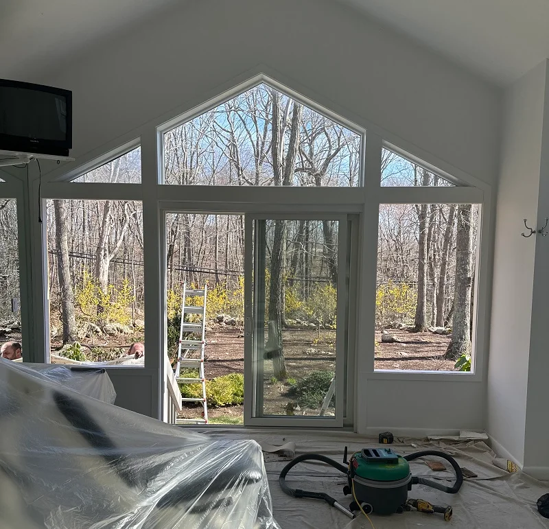Properly prepared window replacement jobsite with a HEPA vac for clean up